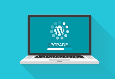 A laptop displaying WordPress upgrading to the most recent version available.